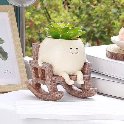 Rocking chair planter with succulent